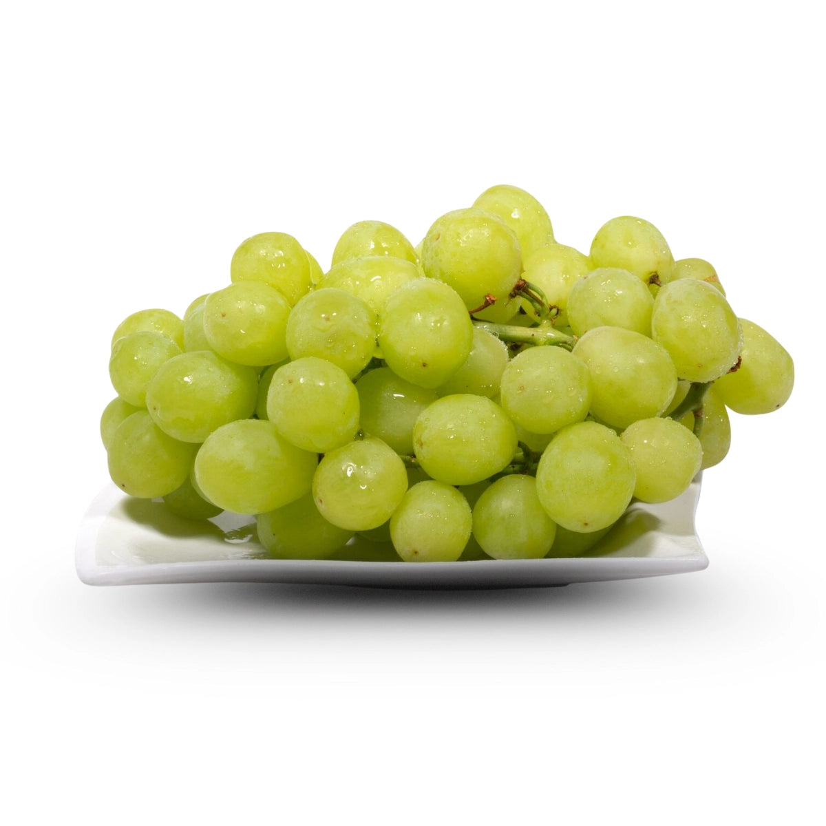 Bunch of green grapes on a white plate with a white background