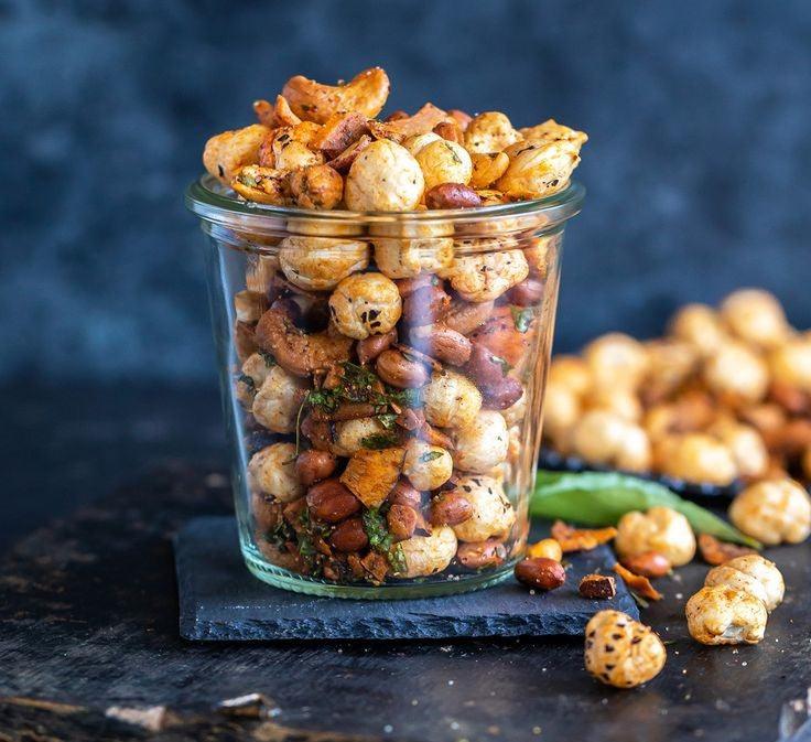 A bowl filled with premium roasted nuts showcasing their golden-brown color and crunchy texture.