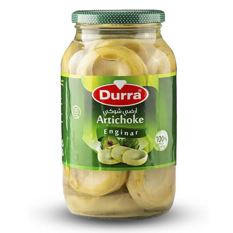 "A large glass jar filled with pickled artichokes, displaying their firm texture and vibrant color."