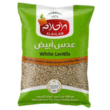 Green package of Al Ahlam white lentils on a white background