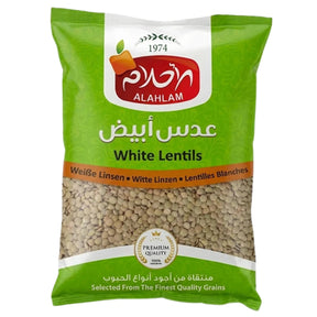Green package of Al Ahlam white lentils on a white background