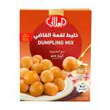 Box of Dumpling Mix with a spoonful of soup on a white background