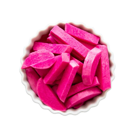 Pink candy pieces in a white bowl on a white background