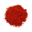 "Sweet Paprika Powder in a rustic wooden spoon on a textured background, surrounded by dried red peppers."