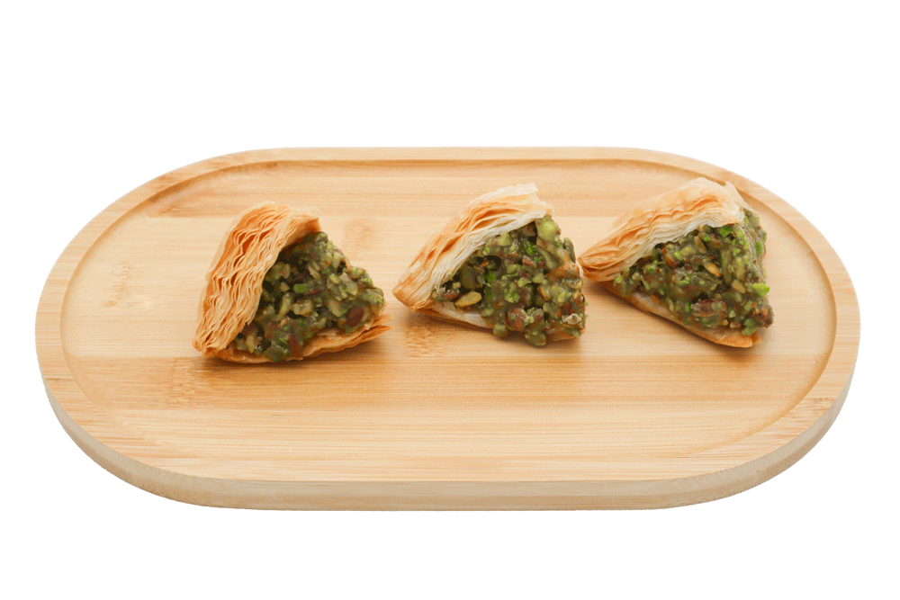 PalmyraOrders' Warbat With Pistachios Piece - Indulge in the sumptuous blend of delicate pastry and luscious pistachios